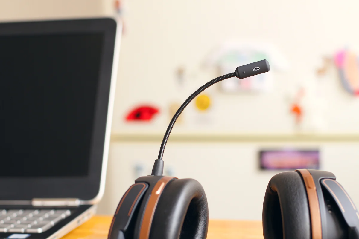 A support headset resting beside a laptop