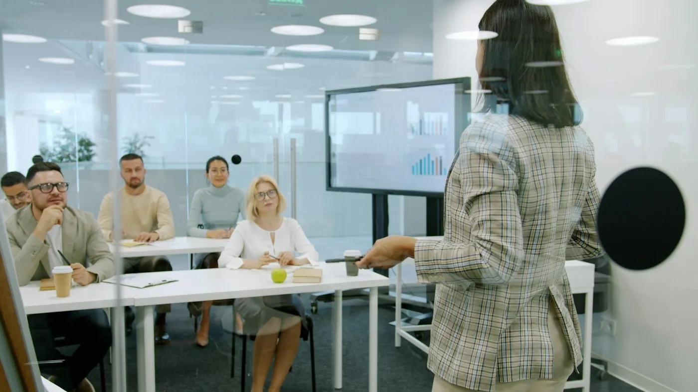 A consultant presenting to colleagues in a training session