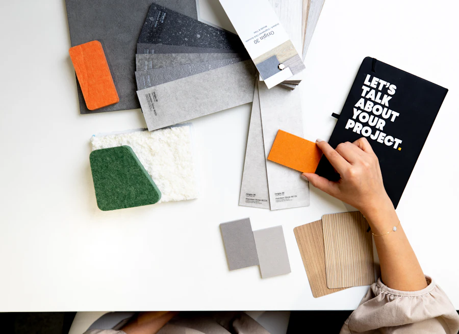 Interior material samples spread across a design studio desk
